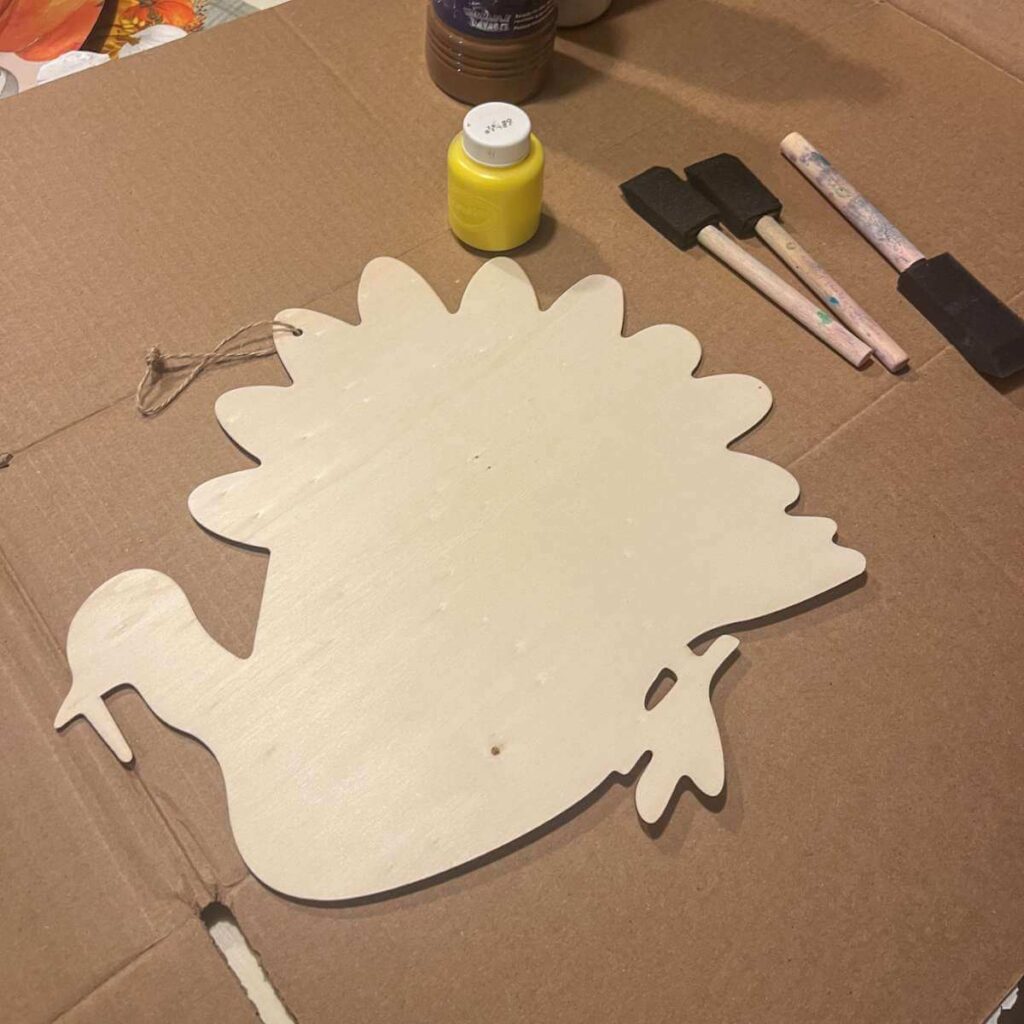 wooden turkey, paint, paint brushes
