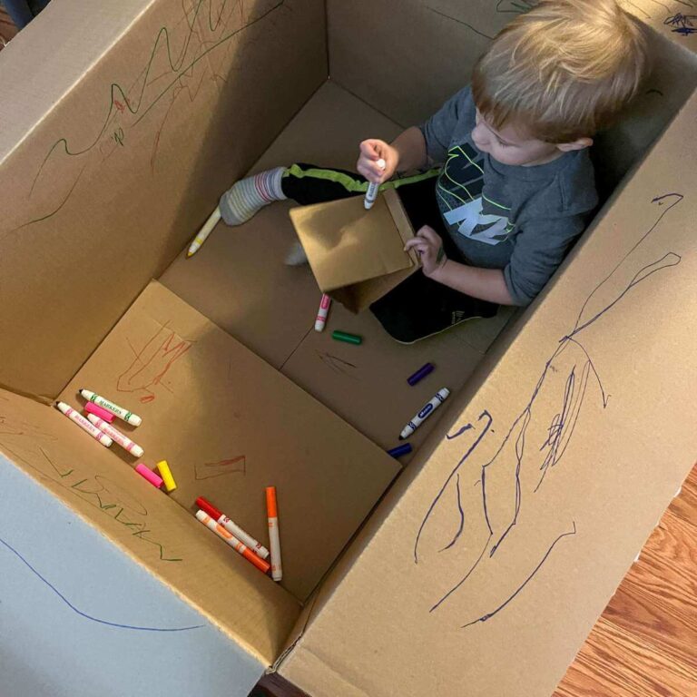 toddler coloring inside a box