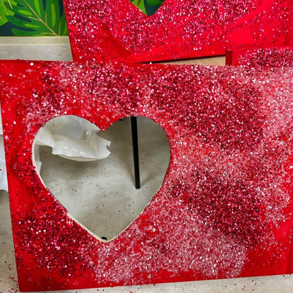 heart frame with red paint and glitter